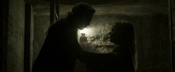 Movie still from “Hidden” (2015), directed by Ross Duffer – A man and a woman are touching each other's hair; Close Up shot, Low angle