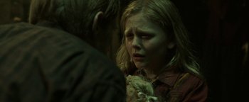 Movie still from “Hidden” (2015), directed by Ross Duffer – A young girl is crying while talking to a young man; Close Up shot, Over the shoulder angle