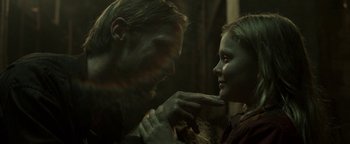 Movie still from “Hidden” (2015), directed by Ross Duffer – A man and a woman are touching each other's face; Close Up shot, Over the shoulder angle