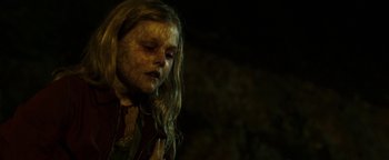 Movie still from “Hidden” (2015), directed by Ross Duffer – A young girl with long blonde hair wearing a red shirt; Close Up shot, High angle