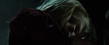 Movie still from “Hidden” (2015), directed by Ross Duffer – A young girl with blonde hair looking down at her face; Close Up shot, Low angle