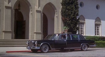 Movie still from “High Anxiety” (1977), directed by Mel Brooks – A black car parked on the side of the street; Wide shot, Low angle