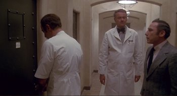 Movie still from “High Anxiety” (1977), directed by Mel Brooks – Two men in white lab coats standing in a hallway; Wide shot, Low angle