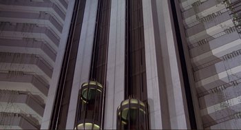 Movie still from “High Anxiety” (1977), directed by Mel Brooks – A very tall building that has a lot of windows on it; Extreme Wide shot, Low angle