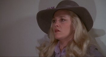 Movie still from “High Anxiety” (1977), directed by Mel Brooks – A woman wearing a hat and a purple shirt; Close Up shot, High angle