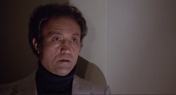 Movie still from “High Anxiety” (1977), directed by Mel Brooks – A person wearing a jacket; Close Up shot, Low angle