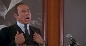 Movie still from “High Anxiety” (1977), directed by Mel Brooks – An older man wearing a suit and tie; Medium shot, Low angle