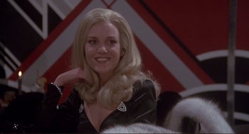 Movie still from “High Anxiety” (1977), directed by Mel Brooks – A woman with blonde hair sitting in a room; Close Up shot, Low angle