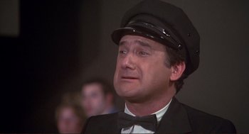 Movie still from “High Anxiety” (1977), directed by Mel Brooks – A man wearing a hat and a bow tie; Close Up shot, Low angle