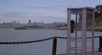 Movie still from “High Anxiety” (1977), directed by Mel Brooks – A phone booth on the shore of a body of water; Extreme Wide shot, High angle