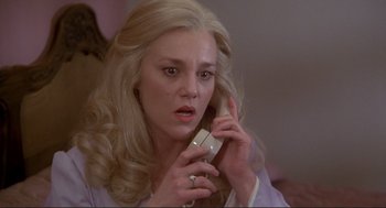 Movie still from “High Anxiety” (1977), directed by Mel Brooks – A woman holding a phone up to her ear; Close Up shot, High angle