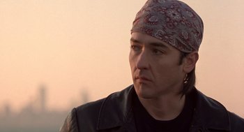 Movie still from “High Fidelity” (2000), directed by Stephen Frears – A person wearing a bandana; Close Up shot, Low angle