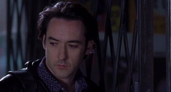 Movie still from “High Fidelity” (2000), directed by Stephen Frears – A person wearing a jacket; Close Up shot, Low angle