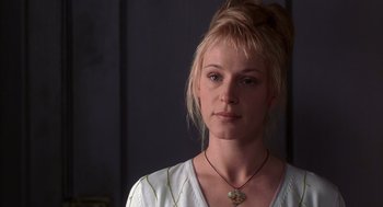 Movie still from “High Fidelity” (2000), directed by Stephen Frears – A woman with blonde hair wearing a white shirt; Close Up shot, Low angle