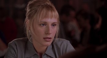 Movie still from “High Fidelity” (2000), directed by Stephen Frears – A person sitting at a table; Close Up shot, Over the shoulder angle