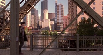 Movie still from “High Fidelity” (2000), directed by Stephen Frears – A view of a city from across a bridge; Extreme Wide shot, High angle