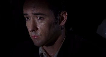 Movie still from “High Fidelity” (2000), directed by Stephen Frears – A person wearing a jacket; Close Up shot, Low angle