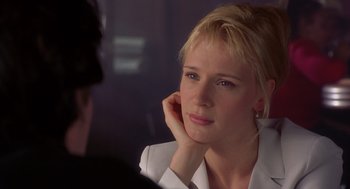 Movie still from “High Fidelity” (2000), directed by Stephen Frears – A beautiful blond woman sitting in front of a mirror; Close Up shot, Over the shoulder angle