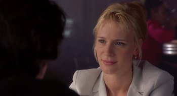 Movie still from “High Fidelity” (2000), directed by Stephen Frears – A beautiful blond woman sitting in front of a man; Close Up shot, Over the shoulder angle