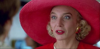 Movie still from “High Heels” (1991), directed by Pedro Almodóvar – A person wearing a hat; Close Up shot, Low angle