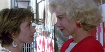 Movie still from “High Heels” (1991), directed by Pedro Almodóvar – A woman and a young girl face each other; Close Up shot, Over the shoulder angle