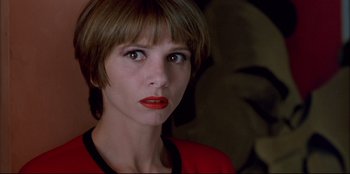 Movie still from “High Heels” (1991), directed by Pedro Almodóvar – A person wearing a red shirt; Close Up shot, Low angle