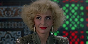 Movie still from “High Heels” (1991), directed by Pedro Almodóvar – A person wearing a jacket; Close Up shot, Low angle