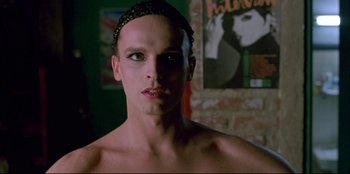 Movie still from “High Heels” (1991), directed by Pedro Almodóvar – A person wearing a head band; Close Up shot, Low angle