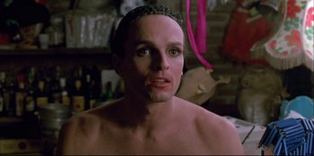 Movie still from “High Heels” (1991), directed by Pedro Almodóvar – A man with a crown on his head; Close Up shot, Low angle