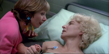 Movie still from “High Heels” (1991), directed by Pedro Almodóvar – Two women talking to each other in a hospital bed; Close Up shot, Over the shoulder angle