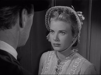 Movie still from “High Noon” (1952), directed by Fred Zinnemann – A man and a woman are looking at one another; Close Up shot, Over the shoulder angle