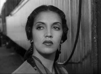 Movie still from “High Noon” (1952), directed by Fred Zinnemann – An old photo of a woman in a black and white photo; Close Up shot, Low angle