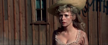 Movie still from “High Plains Drifter” (1973), directed by Clint Eastwood – A woman with a hat on her head; Close Up shot, Low angle