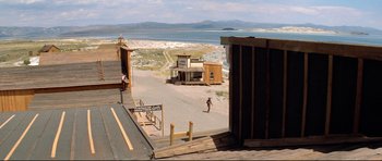 Movie still from “High Plains Drifter” (1973), directed by Clint Eastwood – An old western town with a lake in the background; Extreme Wide shot, High angle
