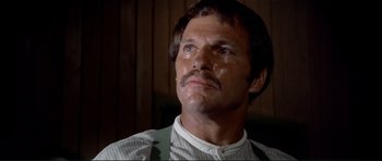 Movie still from “High Plains Drifter” (1973), directed by Clint Eastwood – A person with a mustache; Close Up shot, Low angle