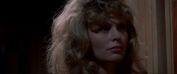Movie still from “High Plains Drifter” (1973), directed by Clint Eastwood – A person with long blonde hair; Close Up shot, Low angle