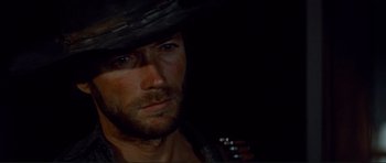 Movie still from “High Plains Drifter” (1973), directed by Clint Eastwood – A person wearing a cowboy hat; Close Up shot, Low angle