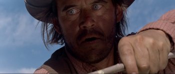 Movie still from “High Plains Drifter” (1973), directed by Clint Eastwood – A person with a beard; Close Up shot, Low angle