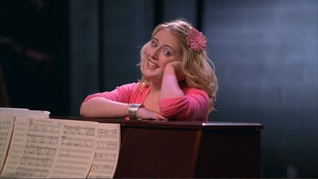 Movie still from “High School Musical” (2006), directed by Kenny Ortega – A woman sitting in front of a piano with her hand on her chin; Close Up shot, Low angle