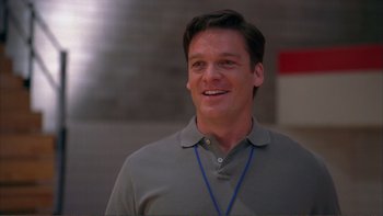 Movie still from “High School Musical” (2006), directed by Kenny Ortega – A person wearing a shirt; Close Up shot, Low angle