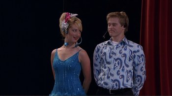 Movie still from “High School Musical” (2006), directed by Kenny Ortega – A man and a woman are dressed up for a show; Medium shot, Over the shoulder angle
