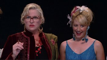 Movie still from “High School Musical” (2006), directed by Kenny Ortega – Two women standing next to each other on a stage; Close Up shot, Over the shoulder angle