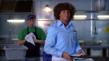 Movie still from “High School Musical 2” (2007), directed by Kenny Ortega – A man in a blue shirt and a man in a green shirt; Medium shot, Over the shoulder angle