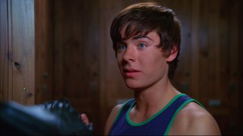 Movie still from “High School Musical 2” (2007), directed by Kenny Ortega – A person with a boxing glove; Close Up shot, Over the shoulder angle
