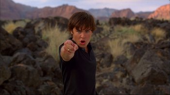 Movie still from “High School Musical 2” (2007), directed by Kenny Ortega – A young man is pointing at the camera with his finger; Close Up shot, Low angle