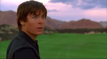 Movie still from “High School Musical 2” (2007), directed by Kenny Ortega – A person looking at the camera; Close Up shot, Over the shoulder angle