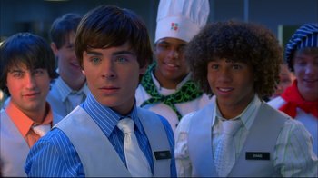 Movie still from “High School Musical 2” (2007), directed by Kenny Ortega – A group of young men standing next to each other; Close Up shot, Over the shoulder angle