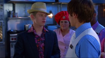 Movie still from “High School Musical 2” (2007), directed by Kenny Ortega – A group of people standing in a room; Close Up shot, Over the shoulder angle