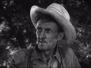 Movie still from “High Sierra” (1940), directed by Raoul Walsh – A black and white photo of a man wearing a cowboy hat; Close Up shot, Low angle