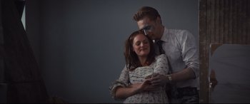 Movie still from “High-Rise” (2015), directed by Ben Wheatley – A man and a woman dressed up as zombies; Medium shot, Low angle